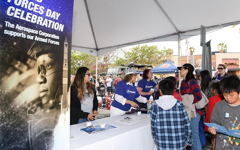 Aerospace employees hand out STEM materials at Torrance Armed Forces Day
