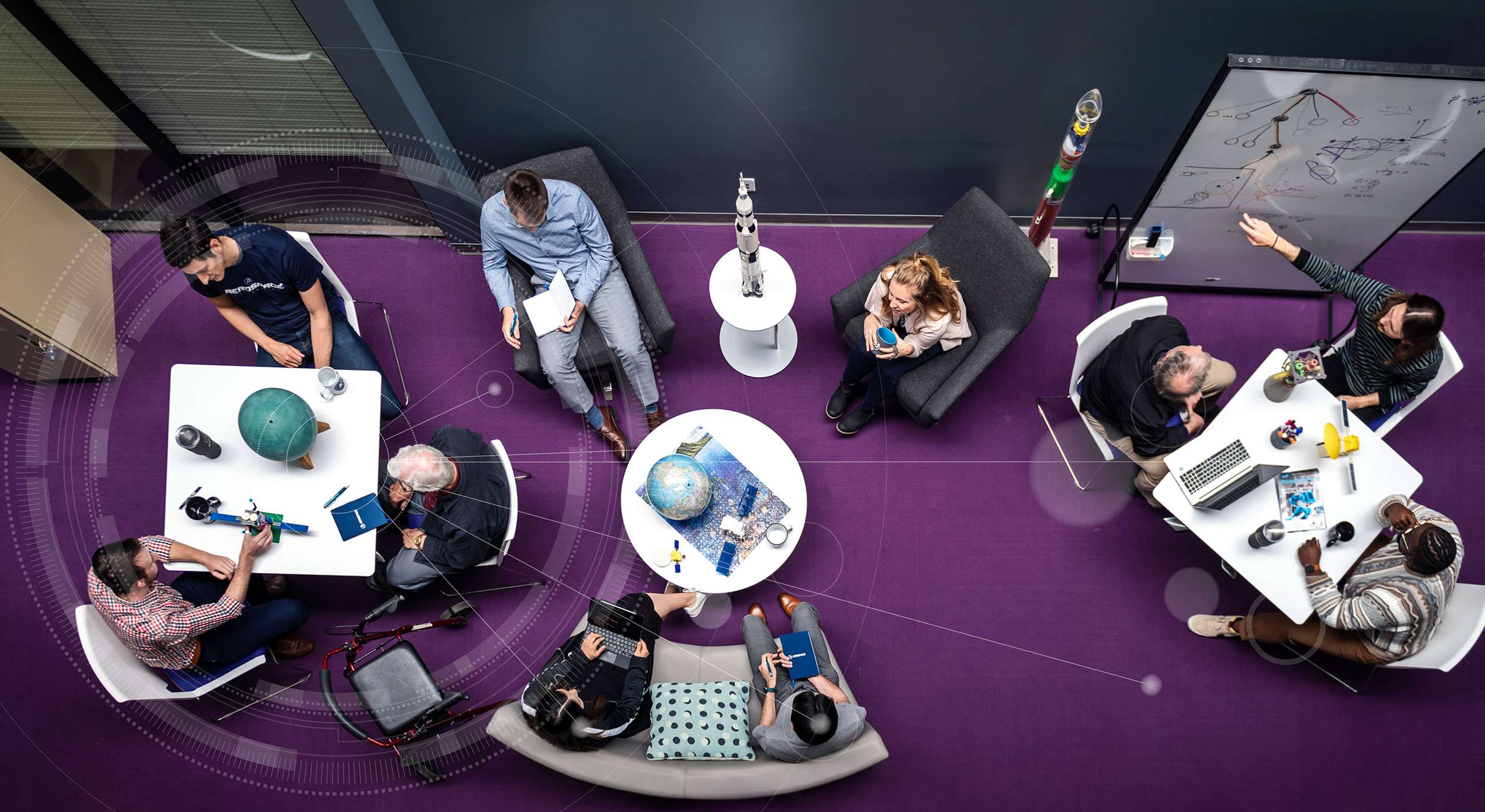 Top view photo of people collaborating in a collaboration space.